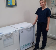 Load image into Gallery viewer, Nurse standing next to the TempArmour Vaccine Refrigerator (Model BFRV36)