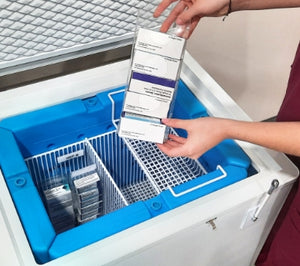 Hand removing products from the TempArmour Vaccine Refrigerator (Model BFRV36)