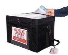 Load image into Gallery viewer, Hand removing a paper from the TempArmour Medical Cooler VCT-21 (Frozen Temperatures) carrier
